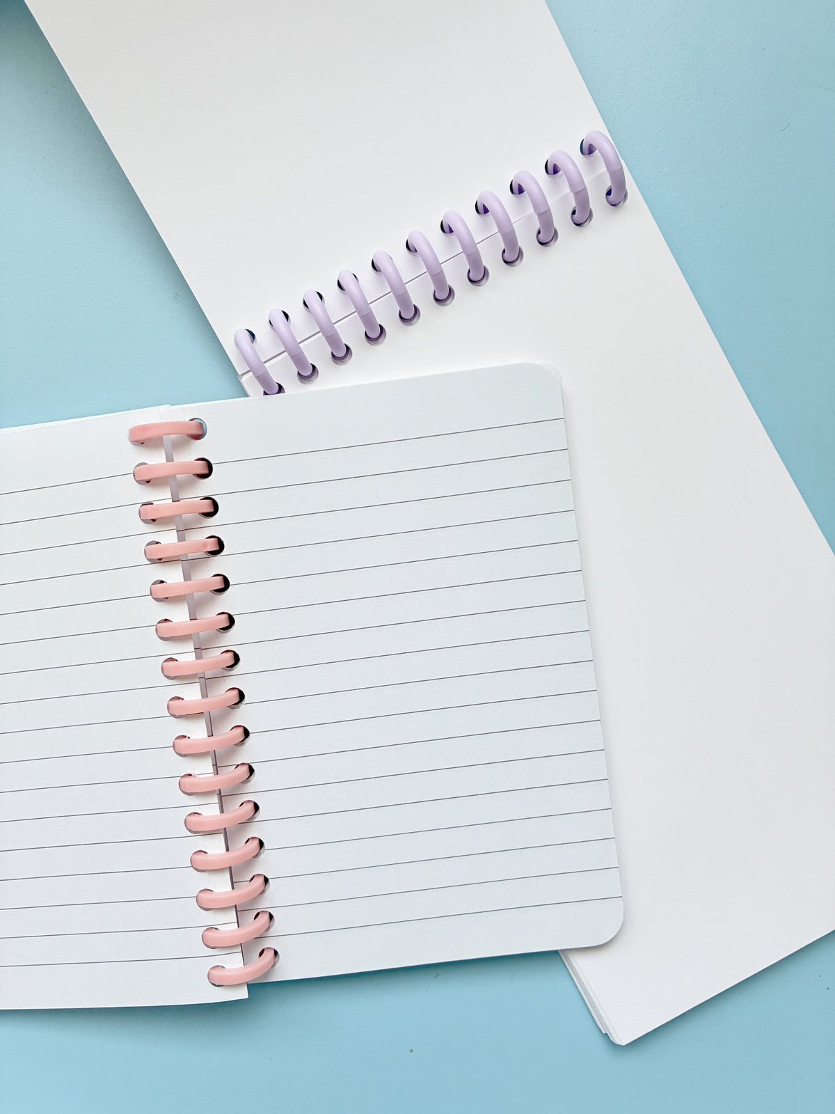 Lot de deux carnets rose et orange